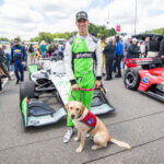 Guests of STING RAY ROBB (77) (USA) of Payette, ID pose for a photo on pit road prior to the start of the Children's of Alabama Indy Grand Prix  at the Barber Motorsports Park in Birmingham  AL.