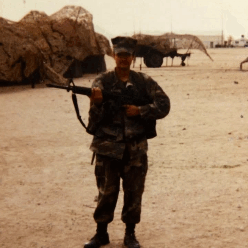 Marine wearing camis holding a gun
