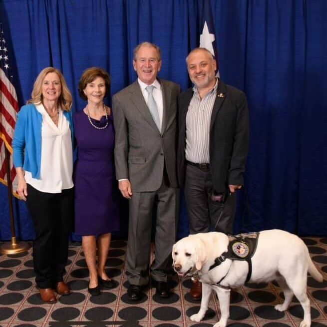 FSD CEO Michele Ostrander, former first Lady Laura Bush, former President George W. Bush, and Tony, a veteran with his FSD service dog, Promise
